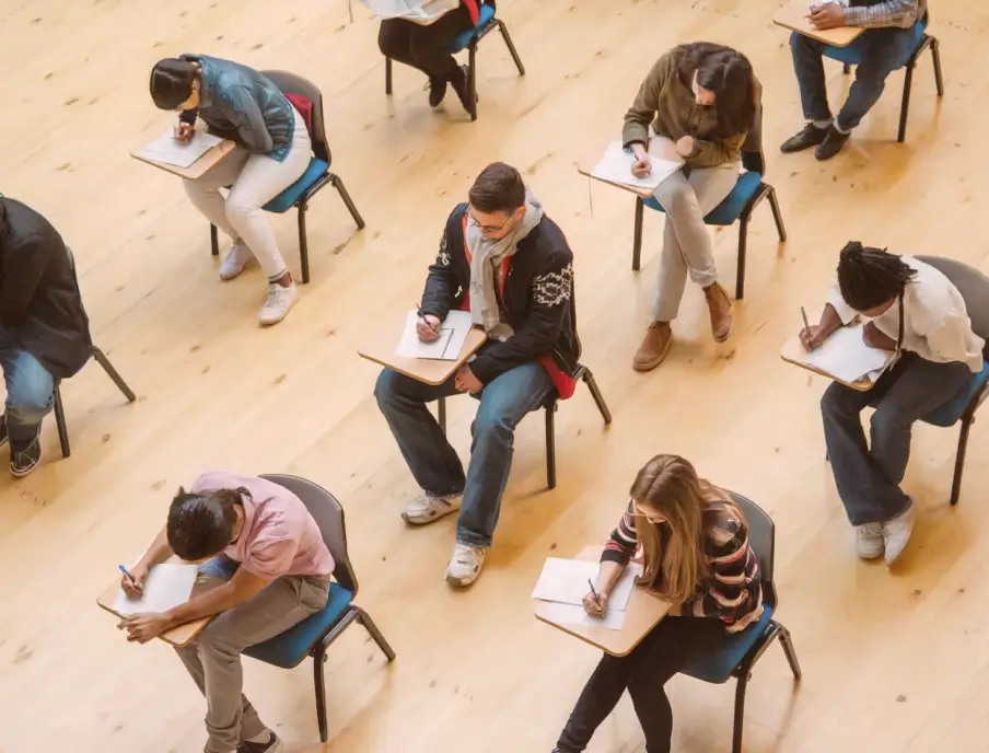 Students sit apart while writing an exam.