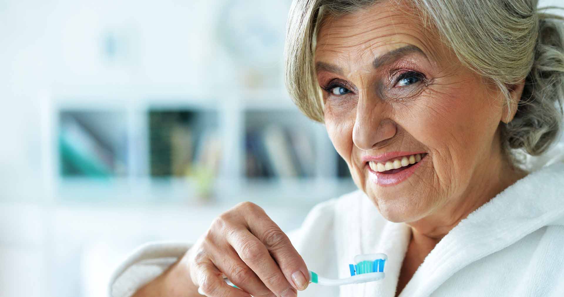 senior brushing teeth
