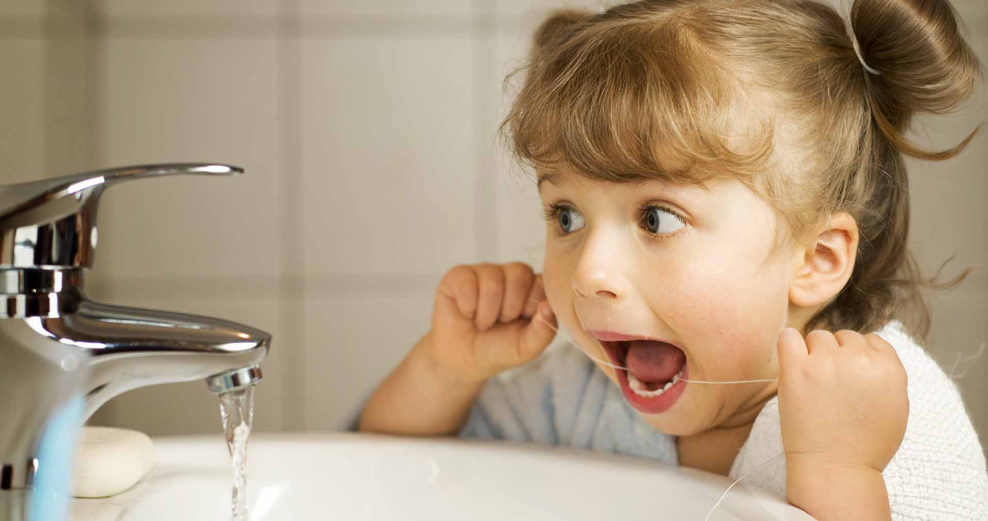 child flossing