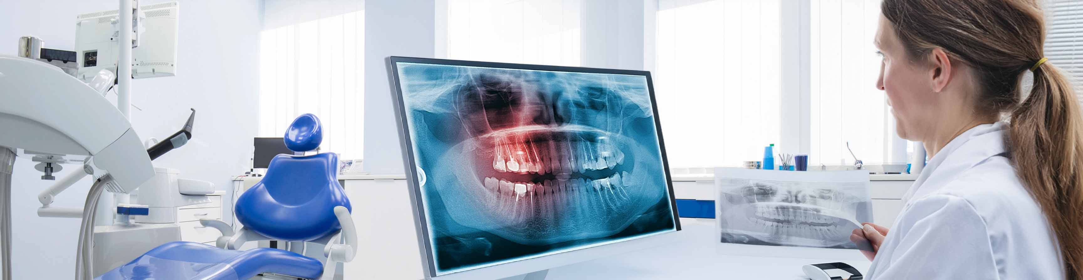 woman at dental computer screen