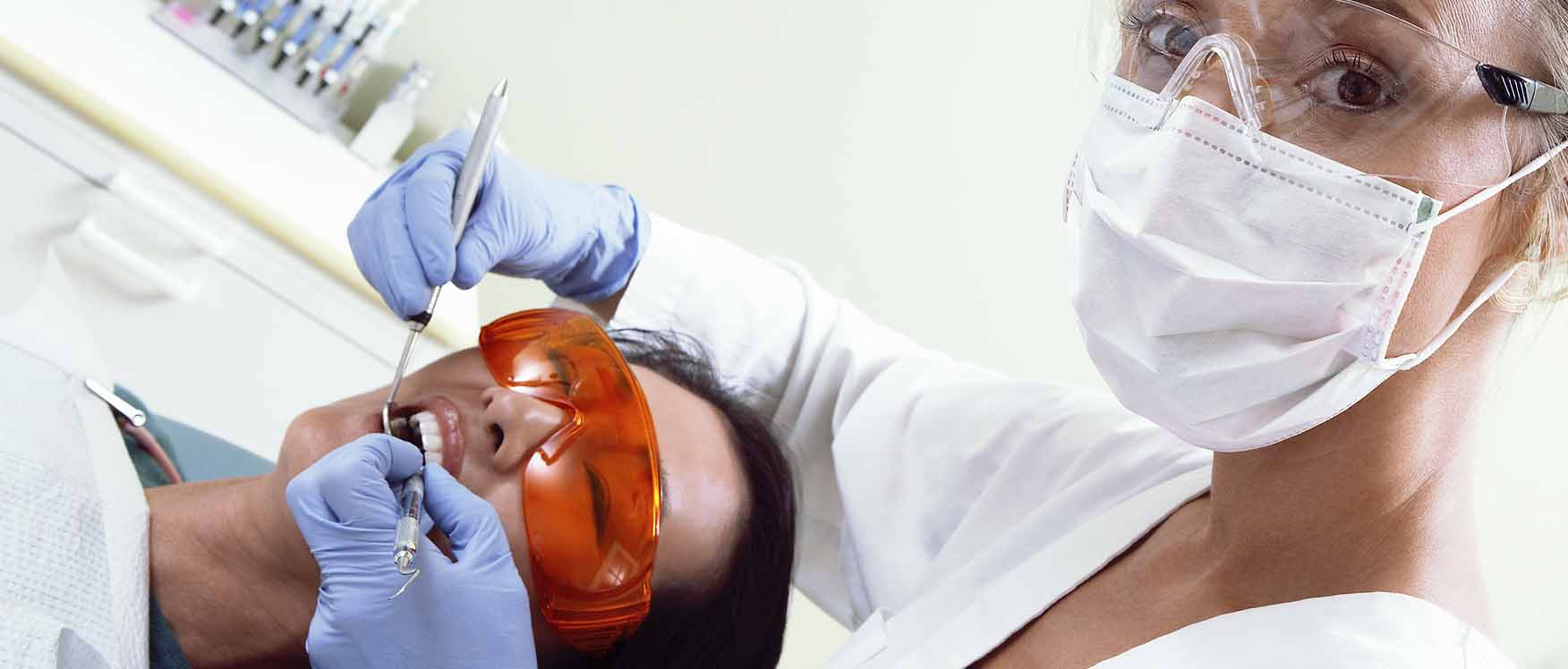 Person in dental chair during procedure