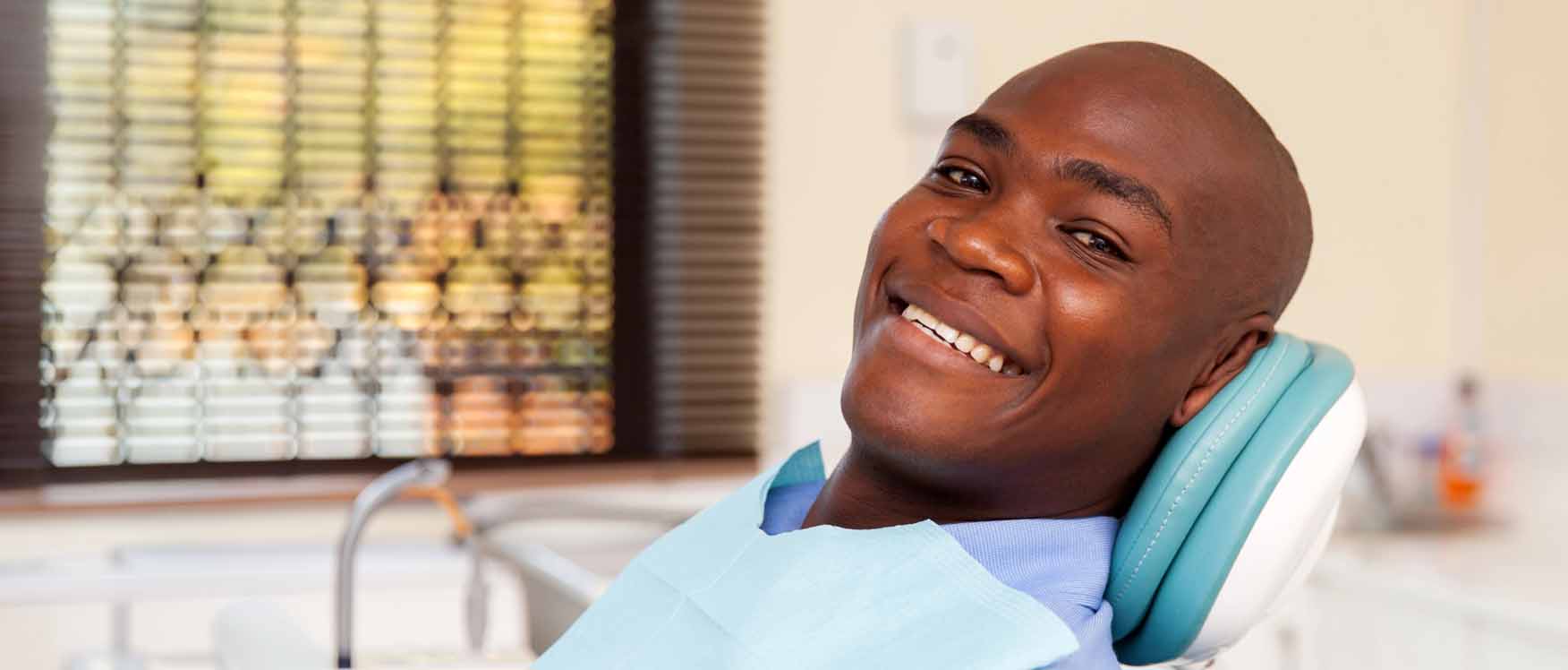 Man smiling in dental chair