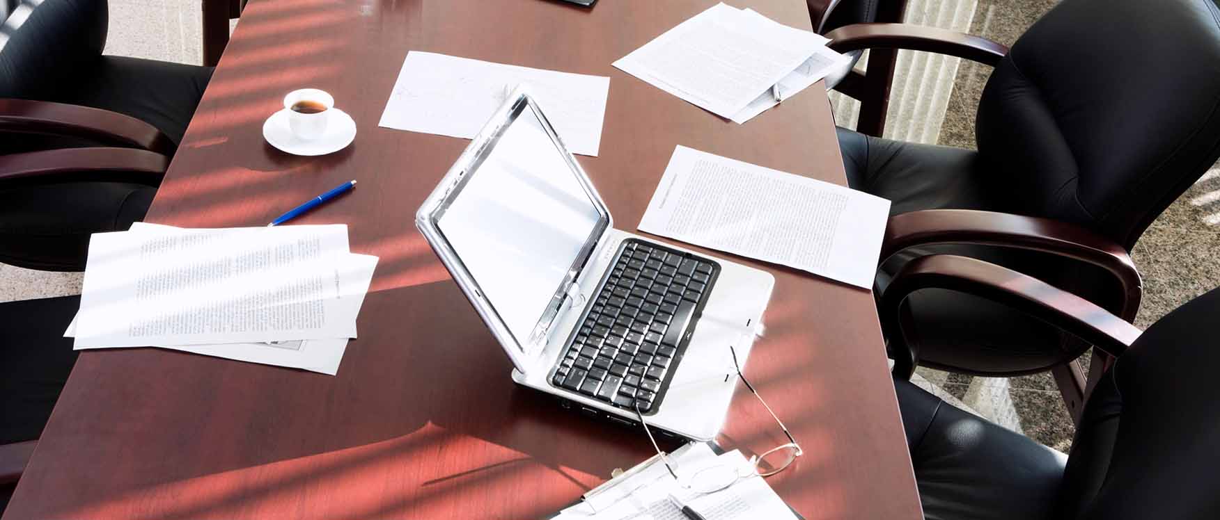 desk with papers and computer