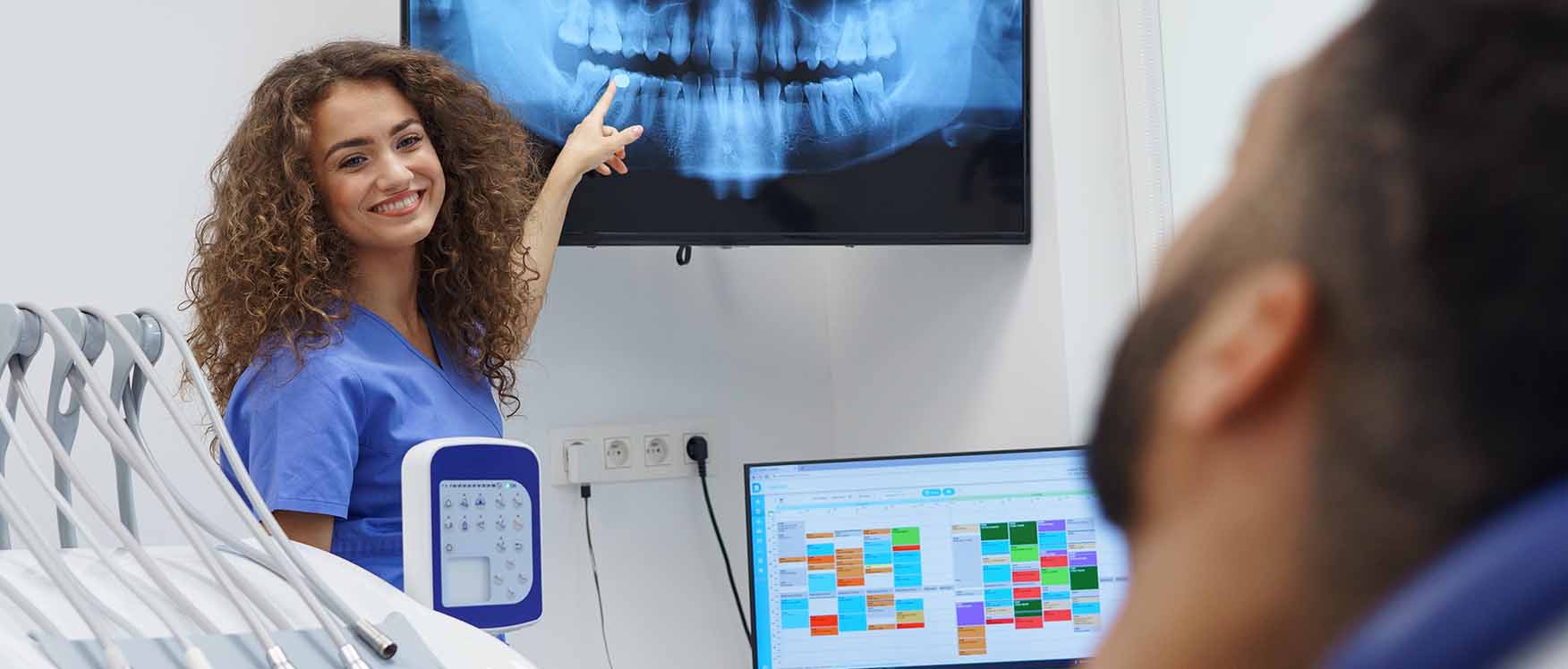 woman points to x-ray