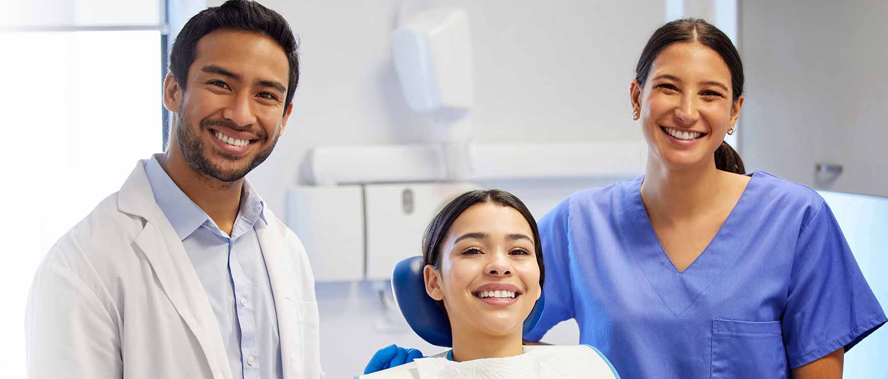 smiling dentists with patient