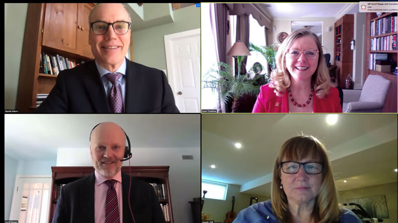 Four people in a video conference call displayed in separate webcam windows.